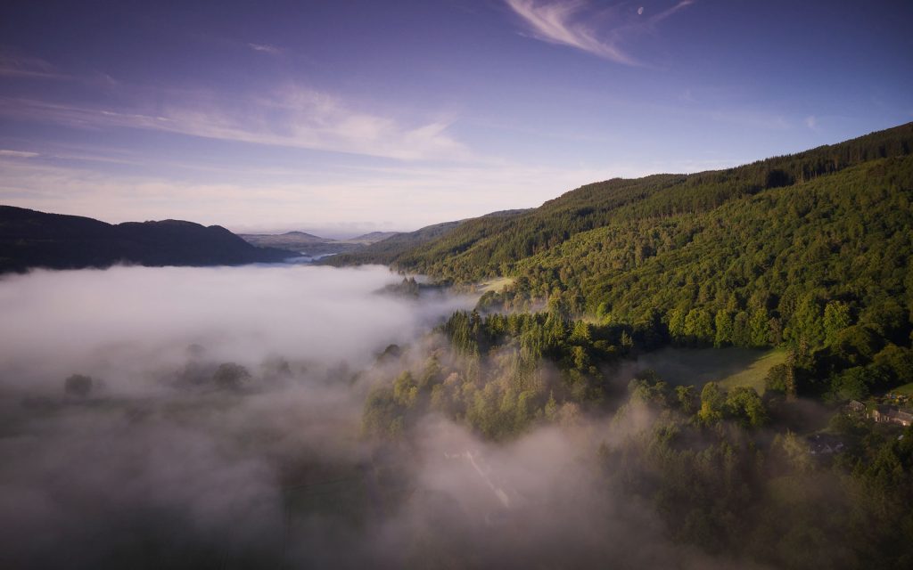 Aerial view of the misty forest surrounding PGL Dalguise in Perthshire