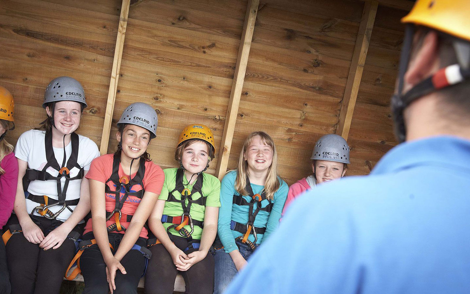 A PGL Activity Instructor leading a climbing session.